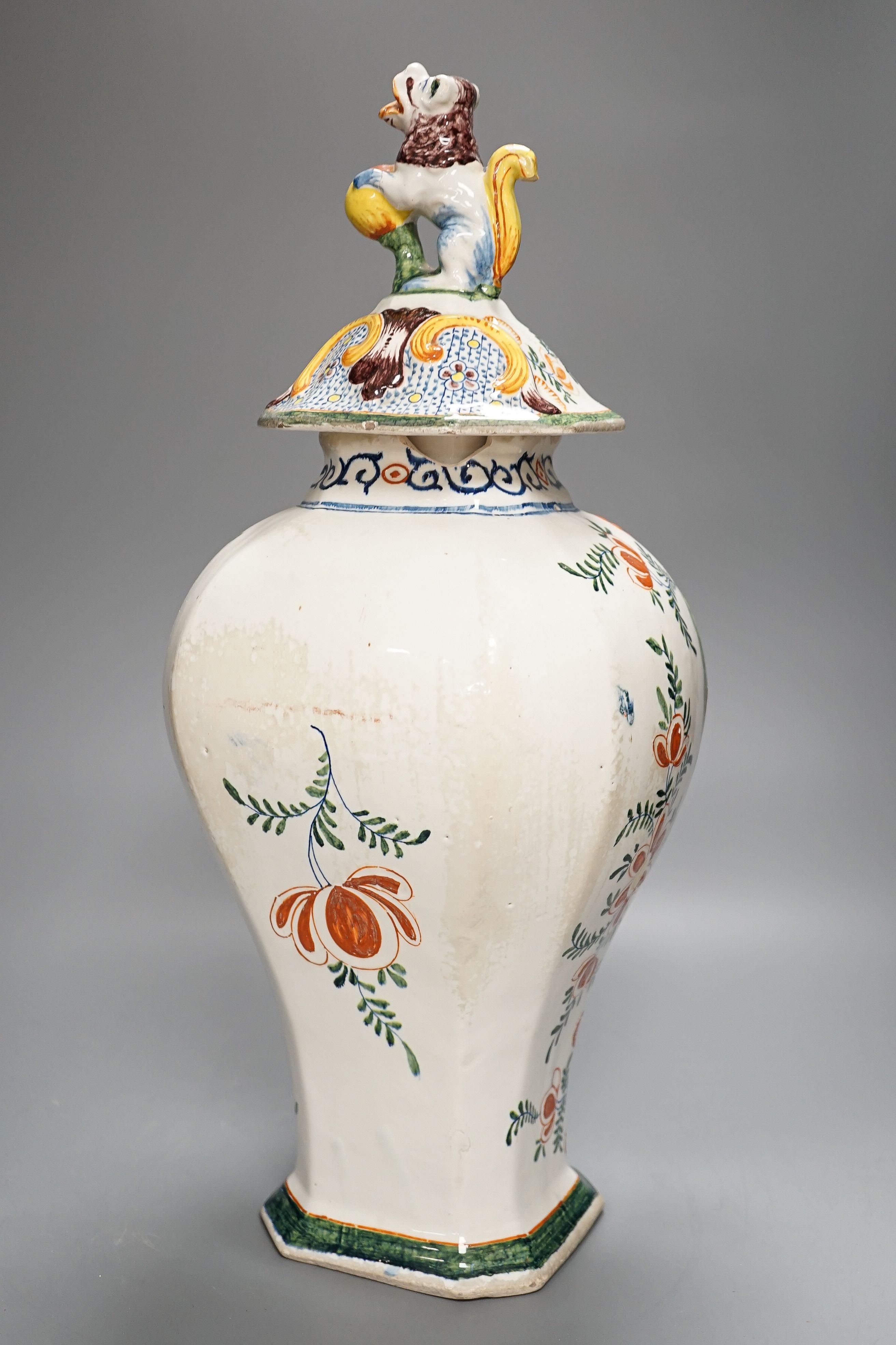 A large 19th century Delft polychrome vase and cover, 46cm, some damage